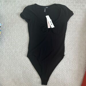 Black aqua ribbed body suit. Never worn with tags. Size small.